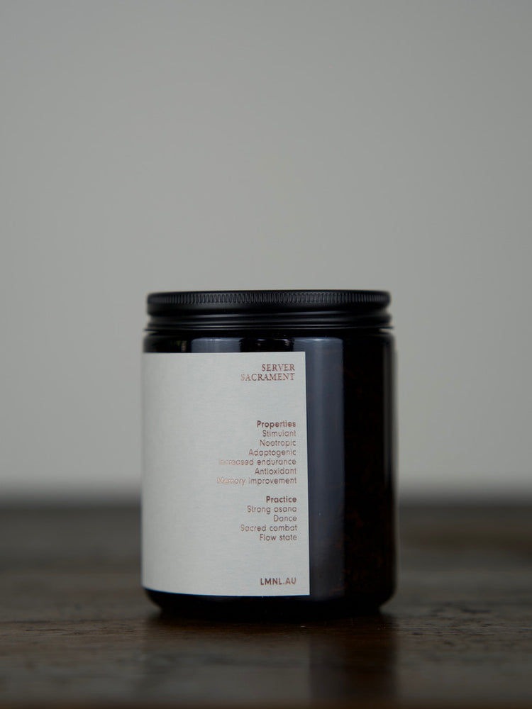 Herbal Tea in an amber glass jar with a matte black lid