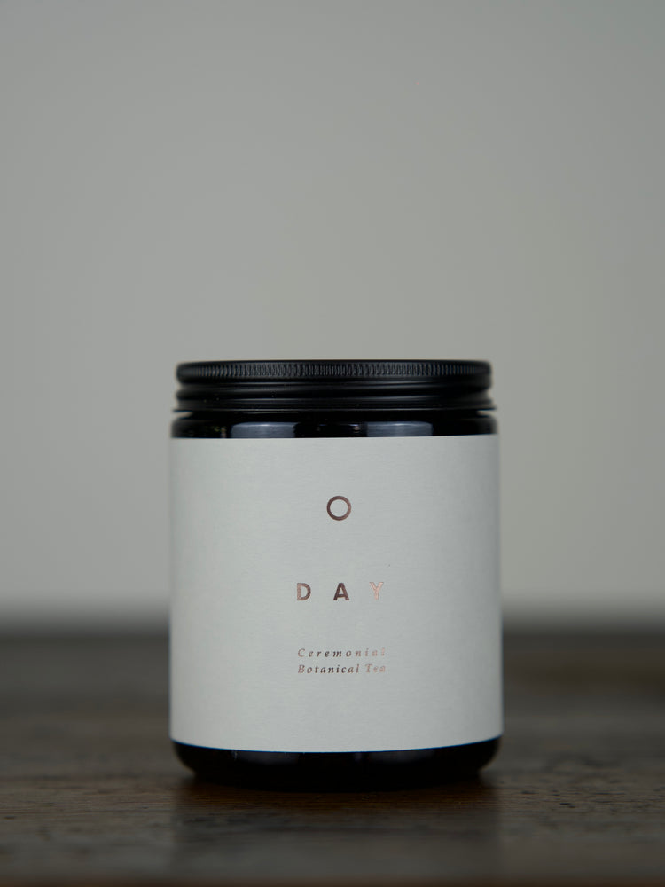 
                  
                    Adaptogenic Herbal Tea in an amber glass jar with a matte black lid
                  
                