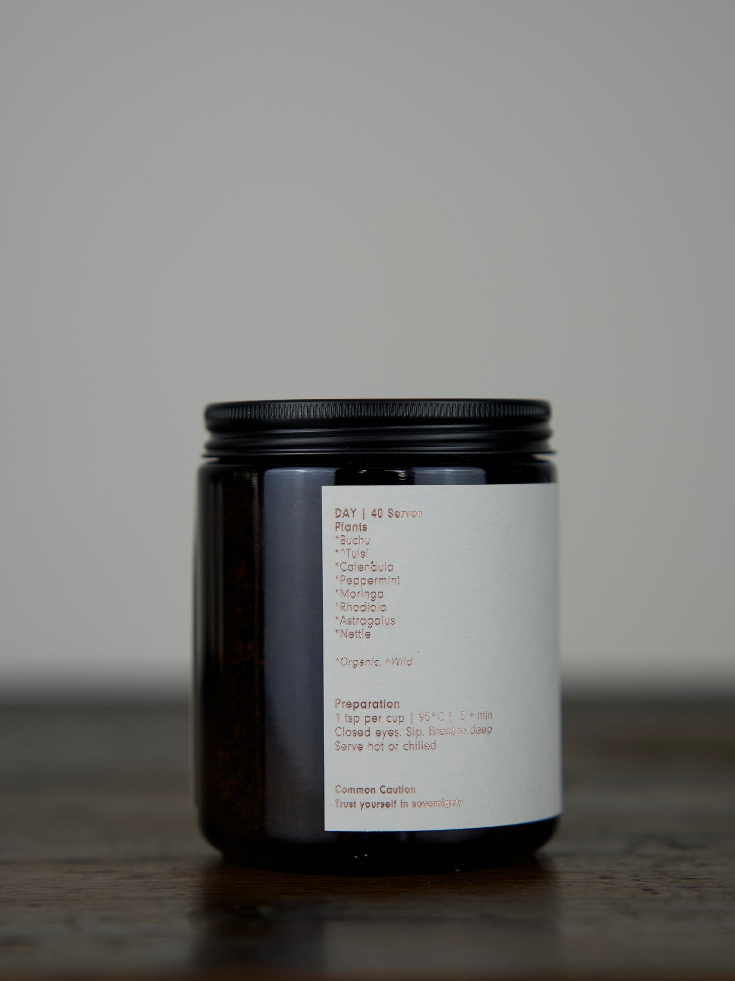 
                  
                    Herbal Tea in an amber glass jar with a matte black lid
                  
                